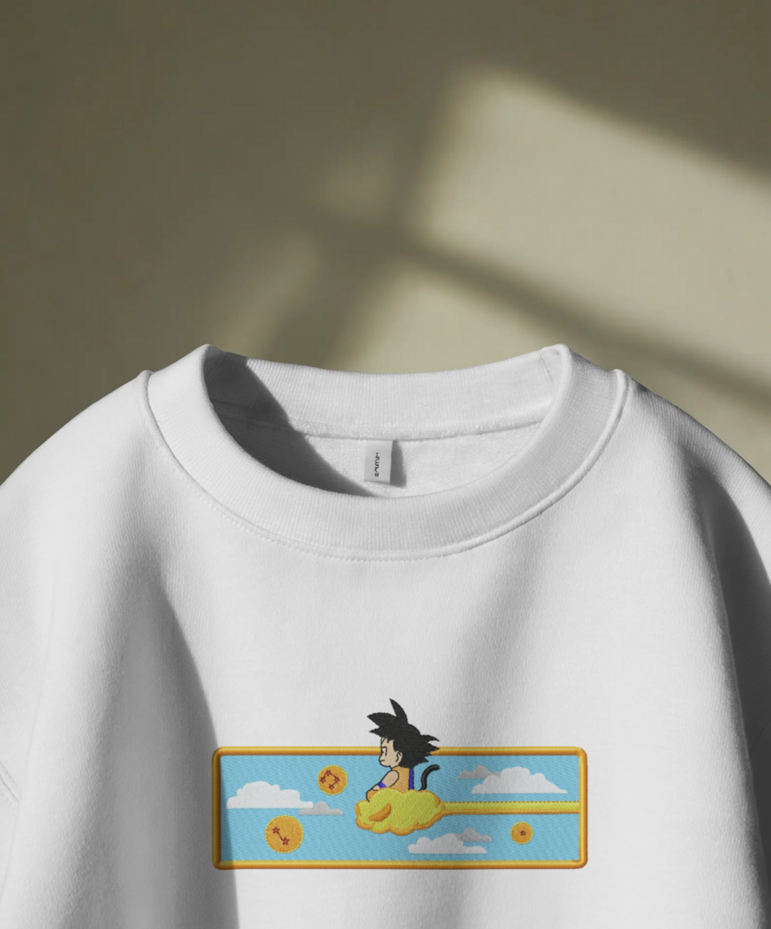 Felpa premium con ricamo "Goku bambino"